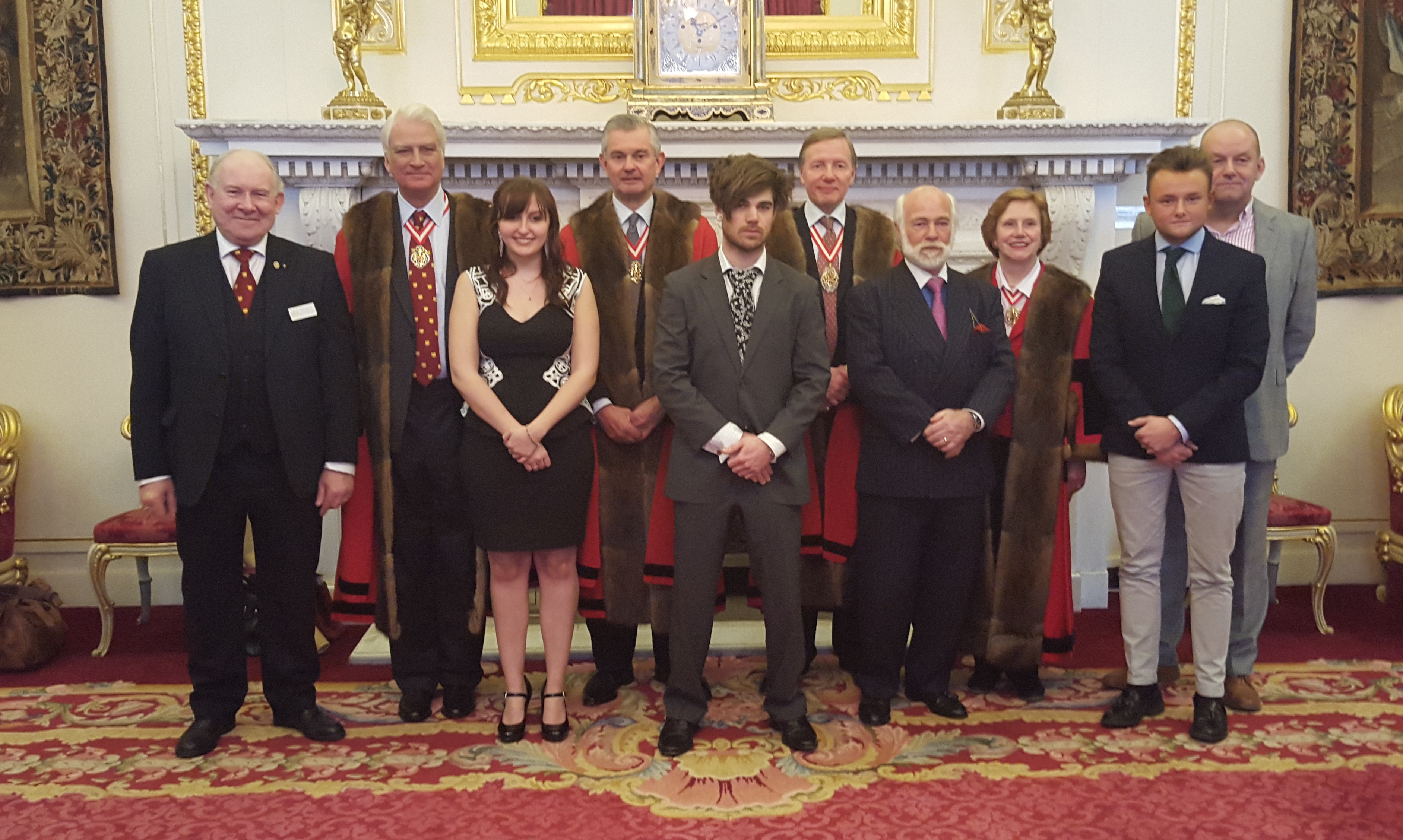 Image: L-R Dave Merry, Warden Michael Prideaux, Candice Devine, Warden Michael Wainright, Ben Hambling, Prime Warden Tim Schroder, Michael Hambling, Warden Judy Lowe, Robert Lord and Russell Lord in the Drawing Room at Goldsmiths’ Hall.