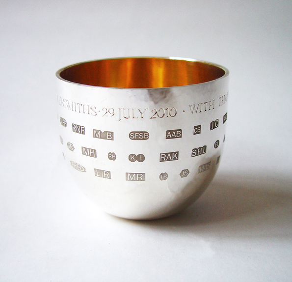 A specially commissioned beaker from 2010 - showing multiple sponsor's marks as decoration.