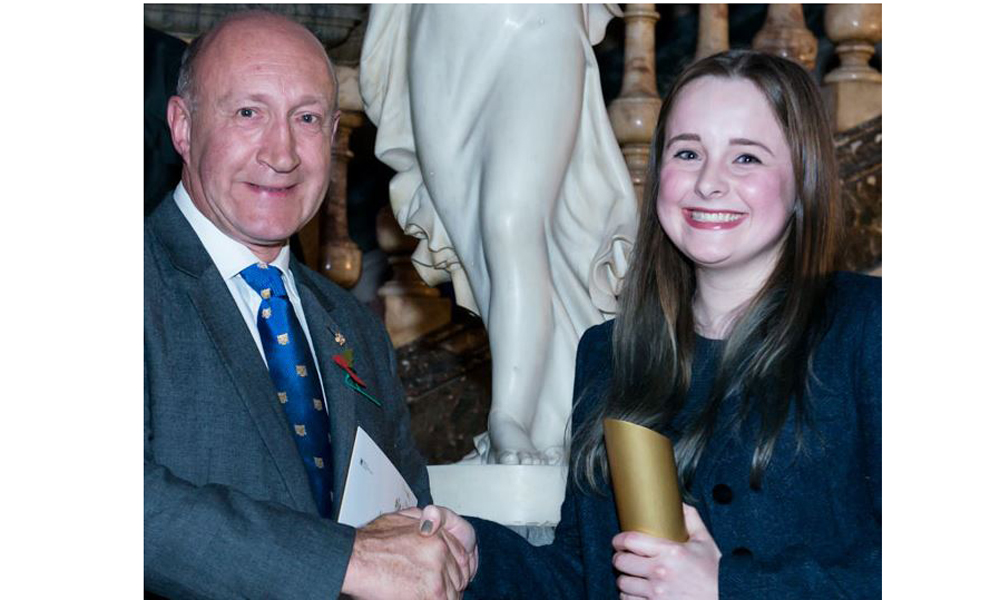 Annabel Hood winner Silversmithing Category with Richard Fox accepting her trophy