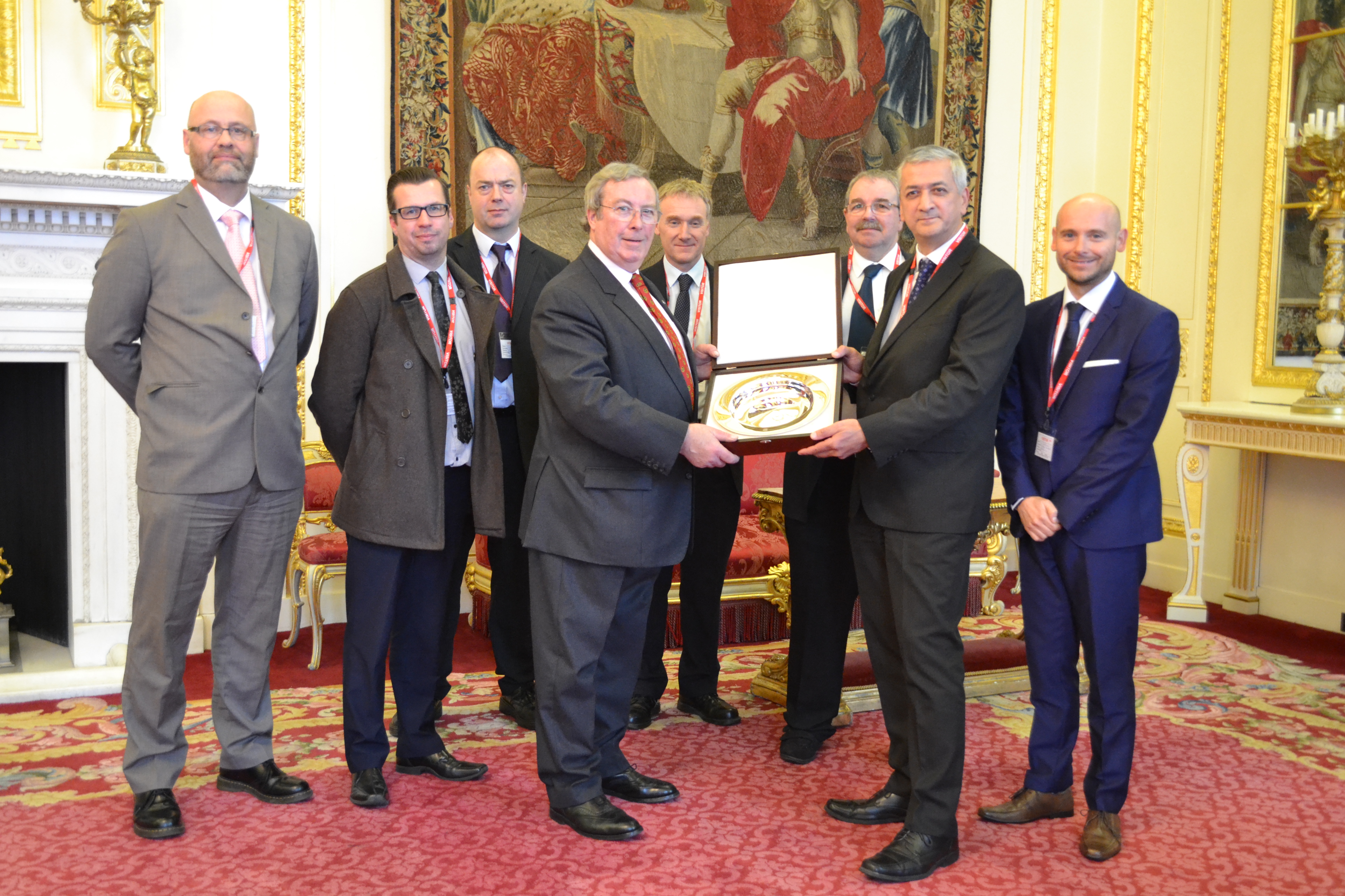 Christopher Jewitt, Chairman of the British Hallmarking Council presents the award to the Hull City Trading Standards team, in the Drawing Room of Goldsmiths' Hall.