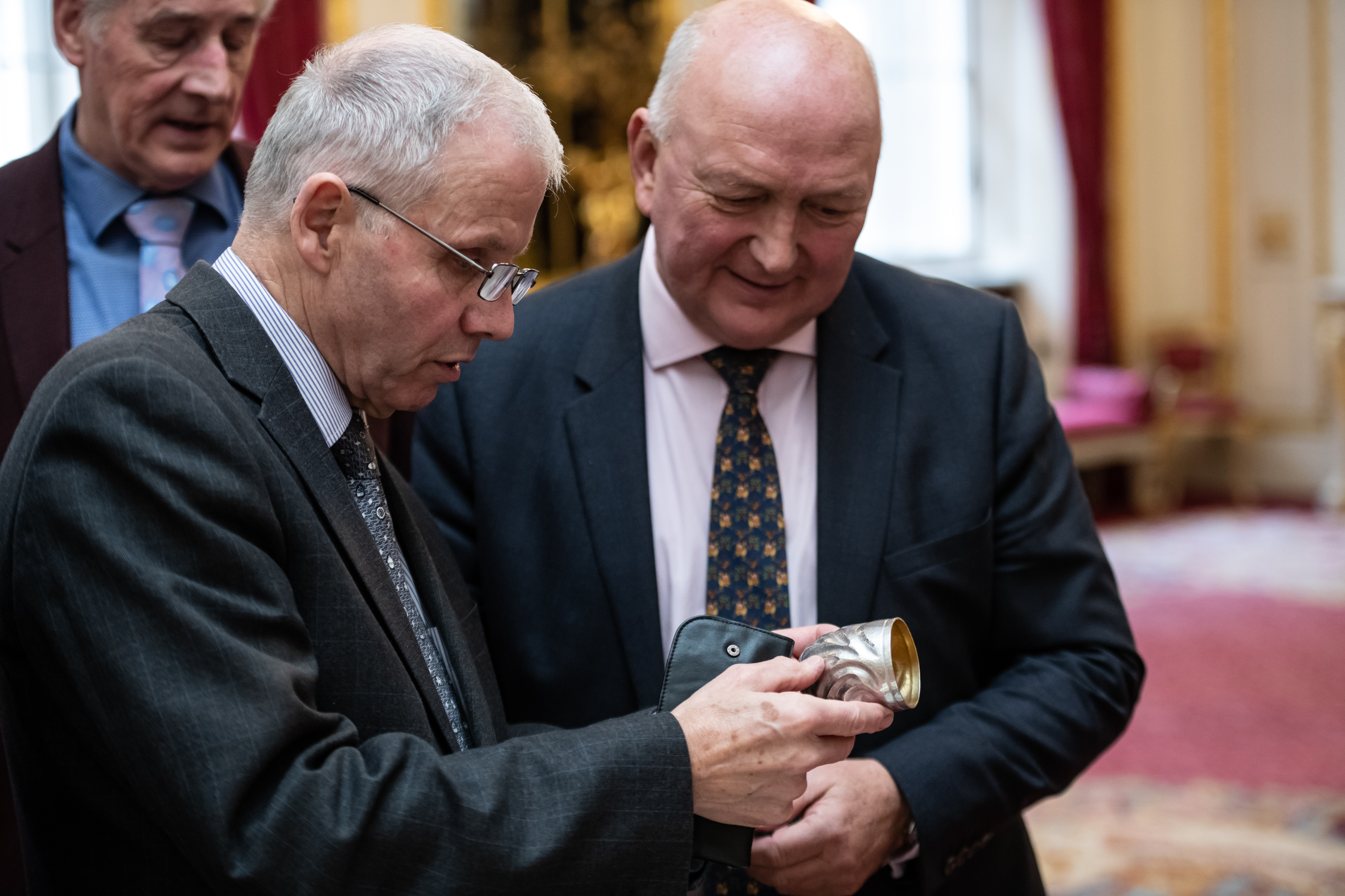 Robert Grice with Goldsmiths' Company Clerk Sir David Reddaway admiring the silver tumbler at Goldsmiths' Hall in November 2019