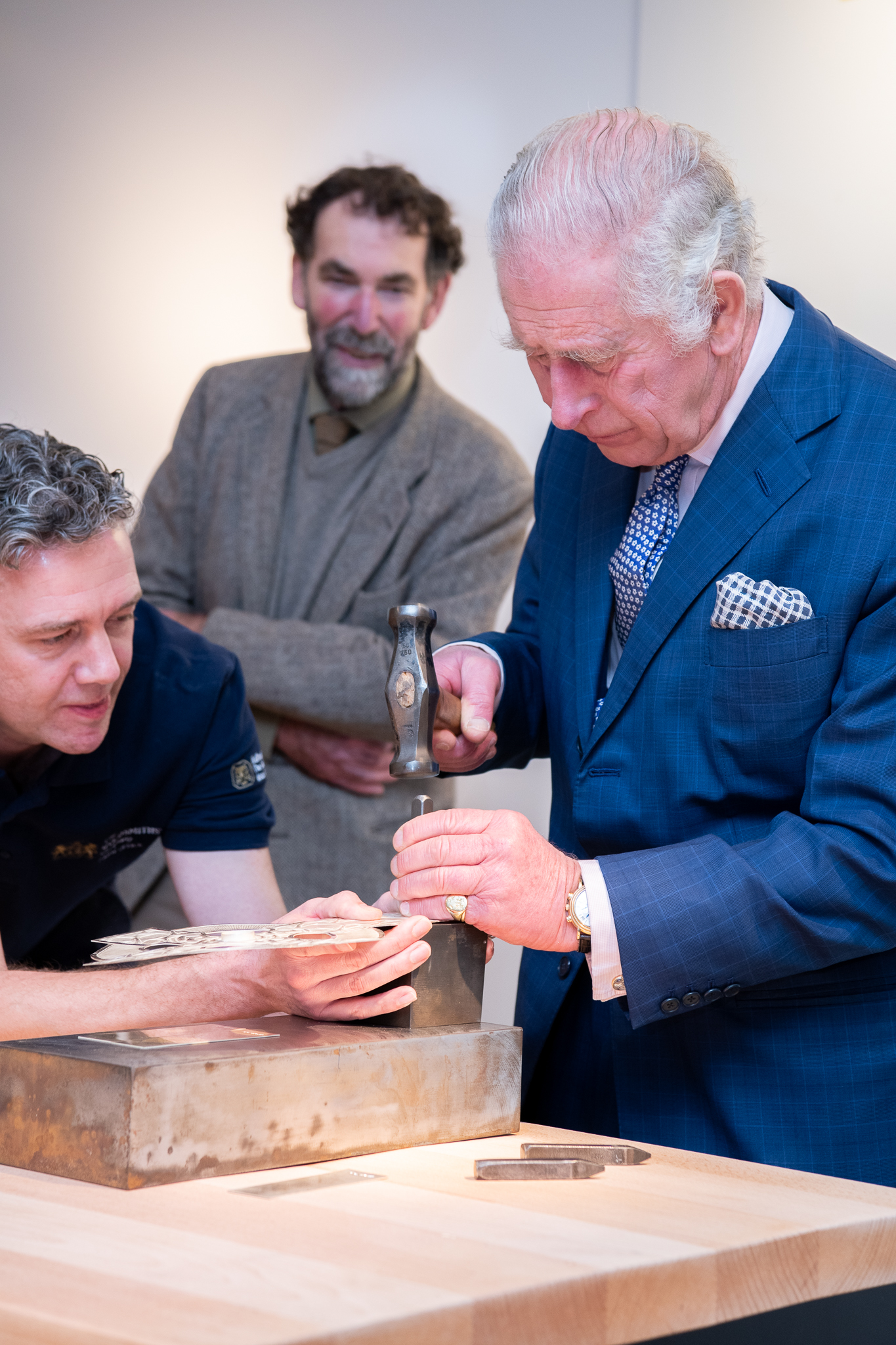 King Charles III hallmarking the King's Mark on a silver Cross of Wales, Photographer - Julia Skupny